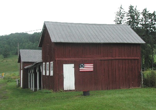 Image of a carriage house from Tioga County that exhibits many of the most common features of its type.