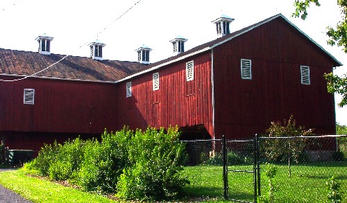 Three-gabled barn sporting decorative roof-ridge cupolas in Northumberland County