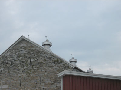 Stone end barn with ventilation slits and added roof ridge metal ventilators, North Cornwall Township, Lebanon County