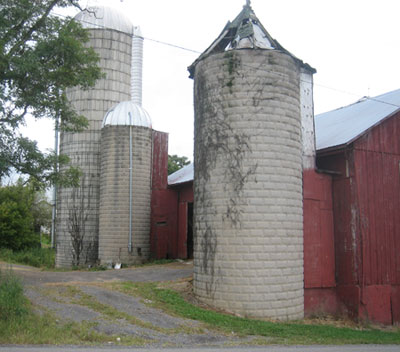Two beveled block silos and a concrete stave silo, Mifflinburg, Union County