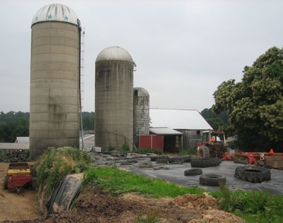 Two poured concrete ring silos, a concrete stave silo, and two tire silos, Highland Township, Chester County