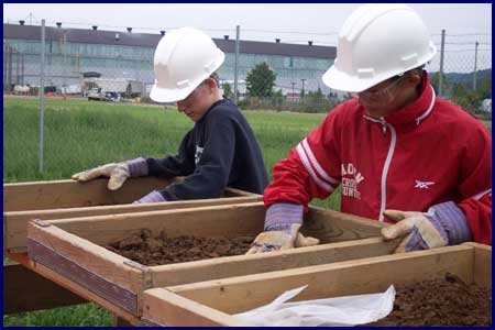 School-aged volunteers learn about archaeology with hands on experience.