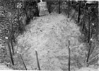 Post-lined storage pit with sticks in posts