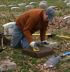 Volunteer Cleaning a headstone