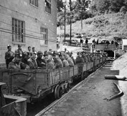 Mine Workers lined in cars