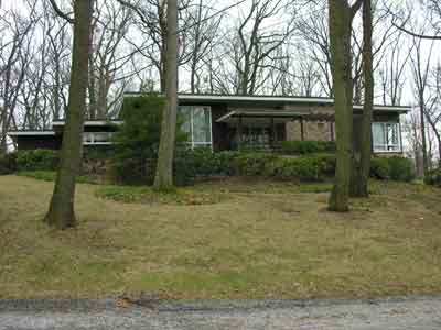 Example of a flat roof Contemporary house, York County
