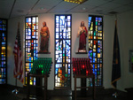 Votive candles and statues