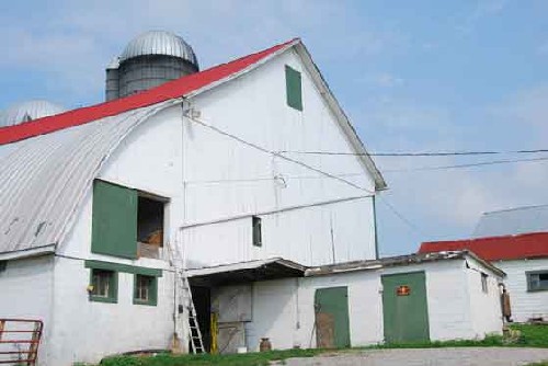 Image showing arched construction of a barn extension