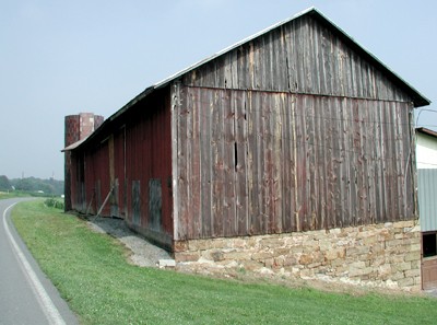 Image of a gable-roofed barn, which appears as an inverted V